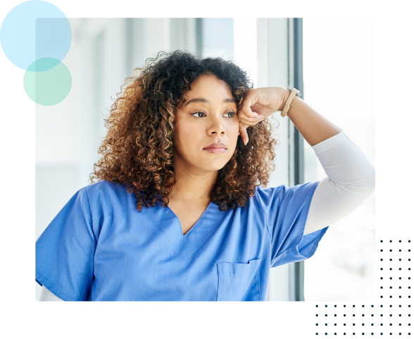 Distressed nurse looking out a window - HealthStream